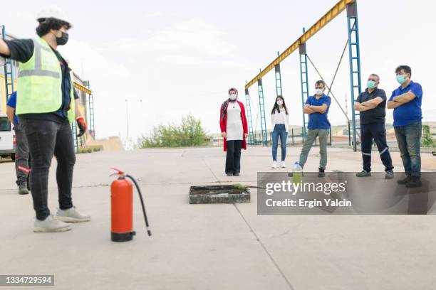 people in the extinguisher training program - prevention stock pictures, royalty-free photos & images