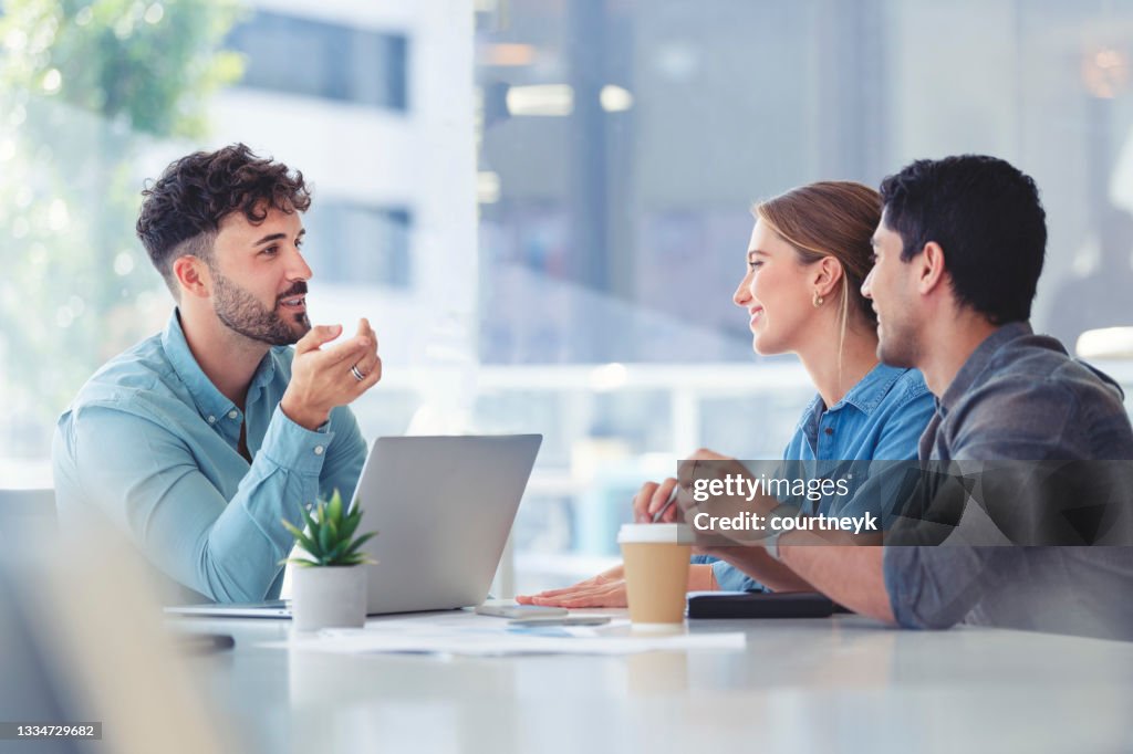 Financial advisor with couple explaining options