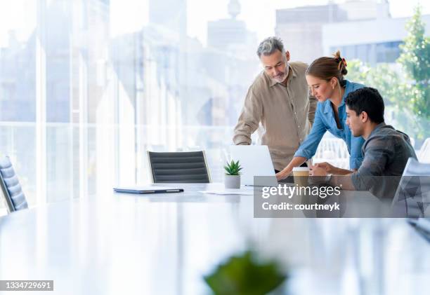 group of business people working. - woman in board room stock pictures, royalty-free photos & images