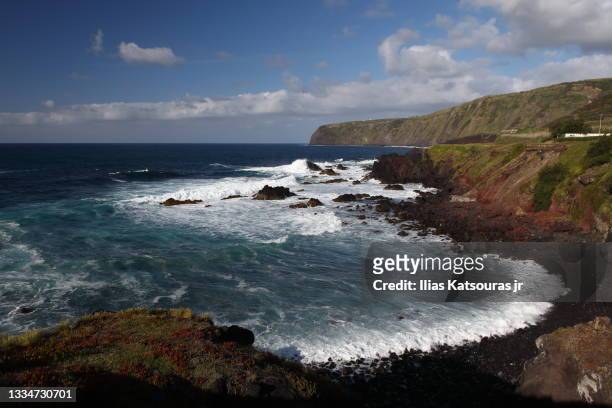 seascape with cliffs under blue cloudy sky, atlantic ocean - fogo photos et images de collection