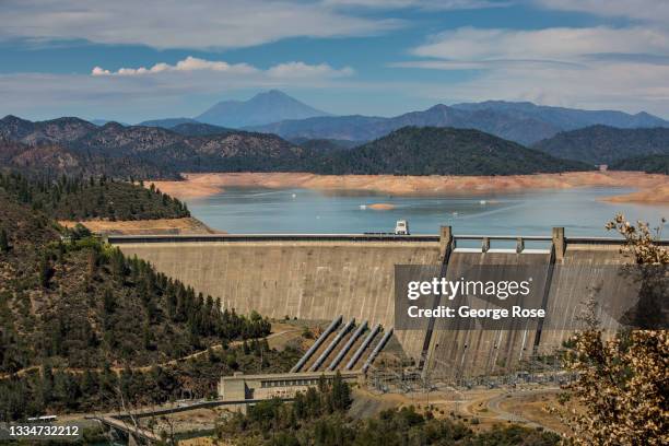 Shasta Dam, storing Shasta Lake, California's largest water reservoir feeding the Sacramento River, now at 30% capacity and at historically low...