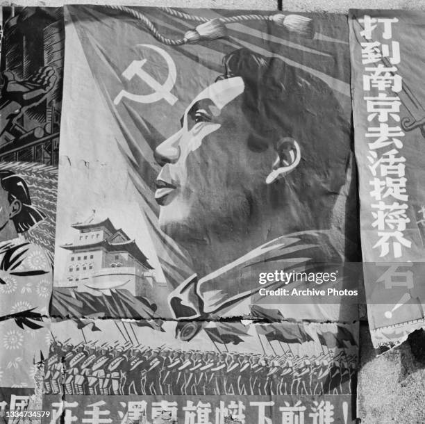 Communist poster depicting the flag of the Communist Party of China above an image of the Chairman of the Chinese Communist Party Mao Zedong , below...