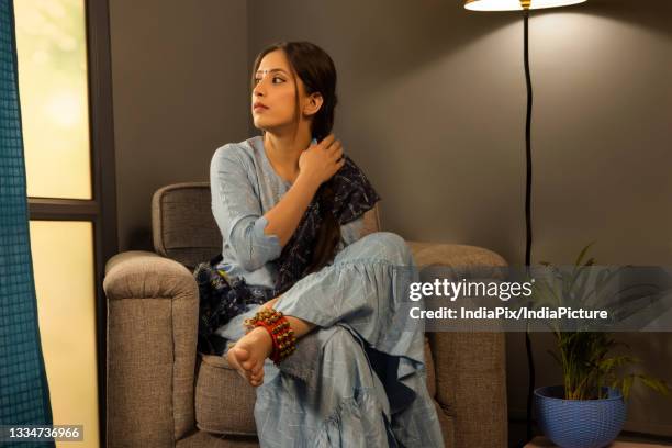 a dancer wearing ghunghroo gazing elsewhere. - ghungroo stock pictures, royalty-free photos & images
