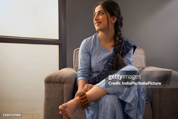 a dancer wearing ghunghroo gazing elsewhere. - ghungroo stock pictures, royalty-free photos & images