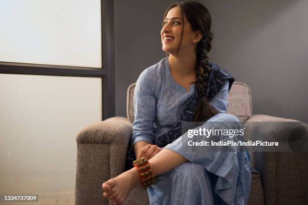 a dancer wearing ghunghroo gazing elsewhere. - ghungroo stock pictures, royalty-free photos & images