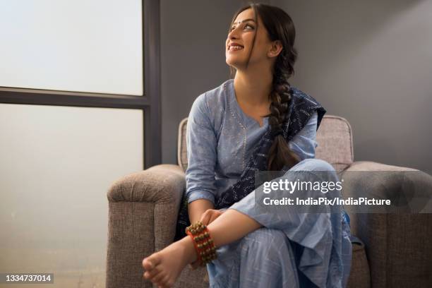 a dancer wearing ghunghroo gazing elsewhere. - ghungroo stock pictures, royalty-free photos & images