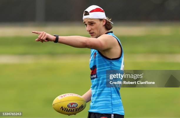 Harrison Jones of the Bombers gestures during an Essendon Bombers AFL training session at The Hangar on August 18, 2021 in Melbourne, Australia.