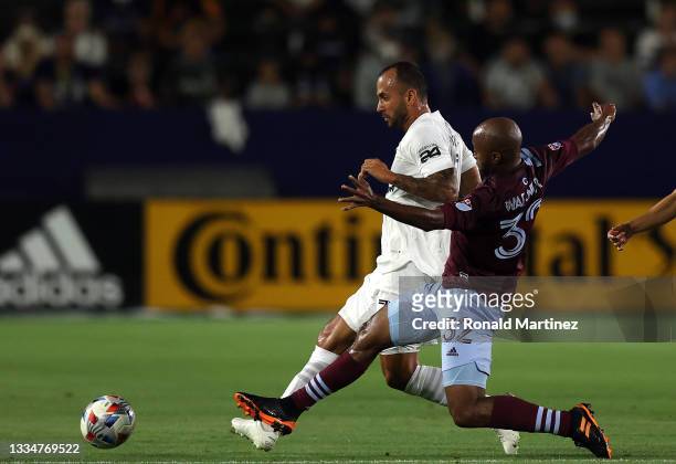 Victor Vazquez of Los Angeles Galaxy controls the ball against Collen Warner of Colorado Rapids in the first half at Dignity Health Sports Park on...