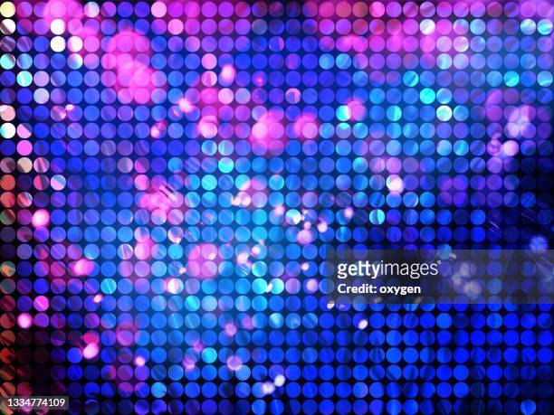 abstract glittered blue pink spotted geometric bokeh light pattern background - rave party photos et images de collection
