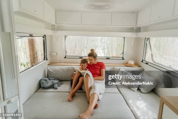 mother roadschooling her son - caravan stockfoto's en -beelden