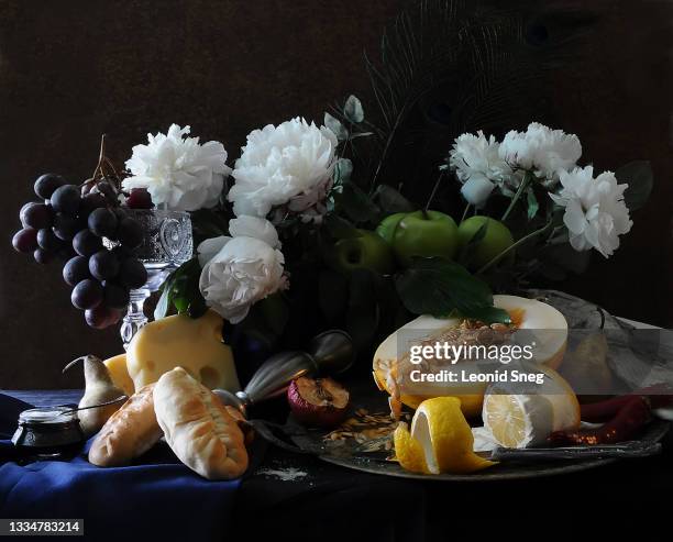 food photography of still life with flowers and fruits front view stylized as a classic dutch (netherlandish) painting on a dark textured background close up - food photography dark background blue stock pictures, royalty-free photos & images