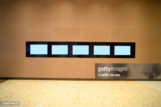 the screen on the wall of the elevator hall - lobby screen stock pictures, royalty-free photos & images