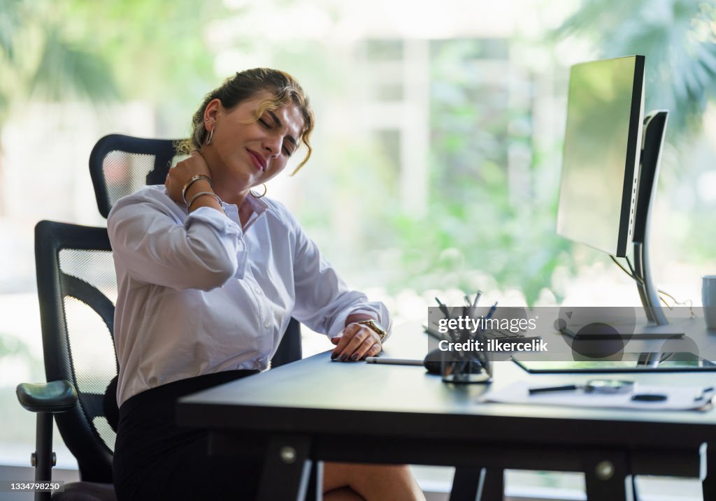 Businesswoman Having Neck Ache Due To Work Over Load And Bad Posture