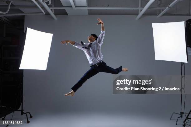 a man in suit dancing - dramatic actor stock pictures, royalty-free photos & images