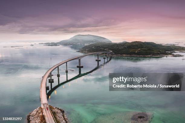 bridge on the arctic sea, sommaroy, norway - atlantic road norway fotografías e imágenes de stock