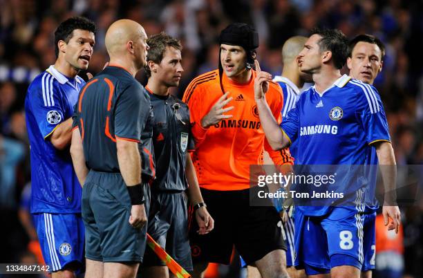 Chelsea players l-r Michael Ballack, Petr Cech and Frank Lampard complain to the referee Tom Henning Ovrebo and his assistant after the final whistle...