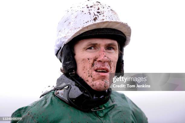 Jockey AP McCoy with mud on his face after pulling up on The Hurl in the 3rd race during day four of the 2010 Cheltenham National Hunt horse racing...