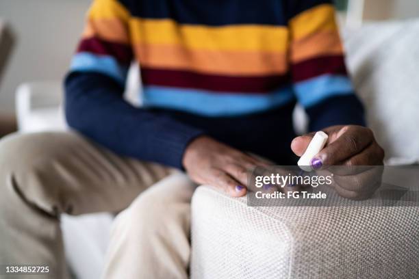 man painting fingernails at home - black gay muscle men stock pictures, royalty-free photos & images