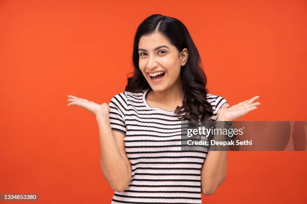 young woman on yellow background - grandness stock pictures, royalty-free photos & images