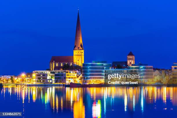 skyline rostock at sunset - rostock stock pictures, royalty-free photos & images