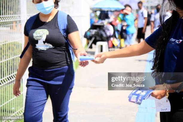 distribution of advertising pamphlet on the street - pamphlet stock pictures, royalty-free photos & images