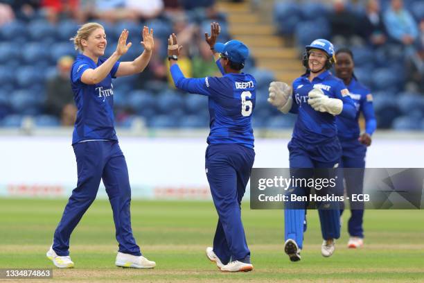 Heather Knight of London Spirit celebrates with teammates after bowling out Georgia Redmayne of Welsh Fire during The Hundred match between Welsh...