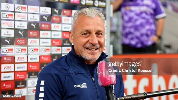 Head coach Pavel Dotchev of Duisburg speaks to the television prior to the 3. Liga match between VfL Osnabrück and MSV Duisburg at Stadion an der...