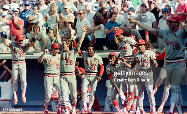 St. Louis Cardinals Jack Clark is surrounded by teammates after hitting pennant-winning home run during playoff series of the Los Angeles Dodgers...