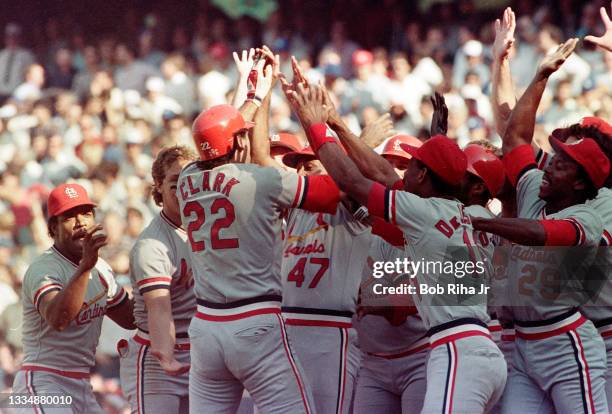 St. Louis Cardinals Jack Clark is surrounded by teammates after hitting pennant-winning home run during playoff series of the Los Angeles Dodgers...