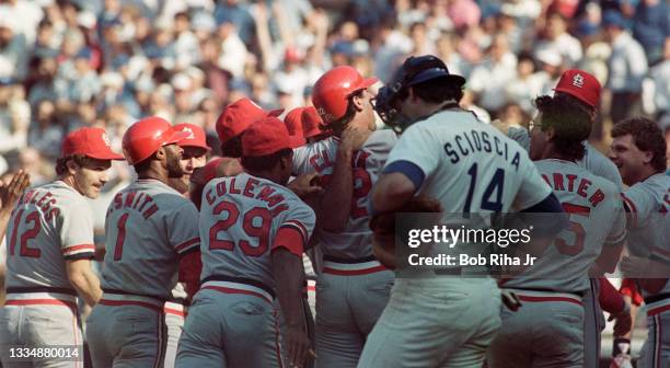 St. Louis Cardinals Jack Clark is surrounded by teammates after hitting pennant-winning home run during playoff series of the Los Angeles Dodgers...