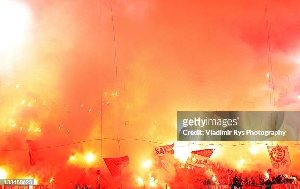 Olympiacos fans light up flares during the Super League match between Olympiacos Piraeus and Panathinaikos FC at Karaiskaki Stadium on November 19,...