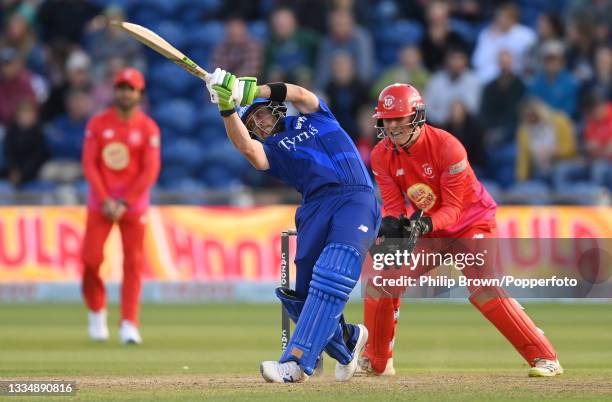 Josh Inglis of London Spirit hits out watched by Tom Banton of Welsh Fire during The Hundred match between Welsh Fire Men and London Spirit Men at...