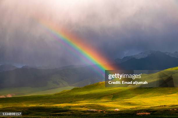 breathtaking view of kakshaal-too mountains, at-bashy district, naryn province, kyrgyzstan - regenboog stockfoto's en -beelden
