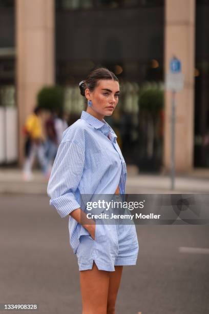 Celine Bethmann wearing blue striped Worst Behavior two piece on August 16, 2021 in Berlin, Germany.