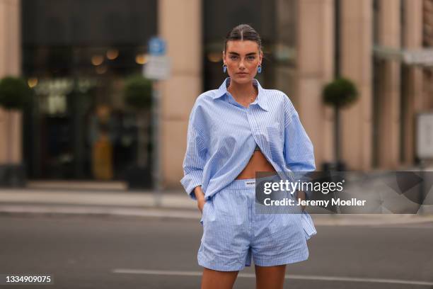 Celine Bethmann wearing blue striped Worst Behavior two piece on August 16, 2021 in Berlin, Germany.