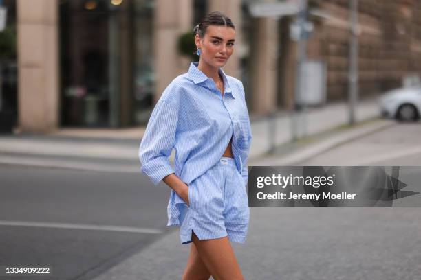 Celine Bethmann wearing blue striped Worst Behavior two piece on August 16, 2021 in Berlin, Germany.