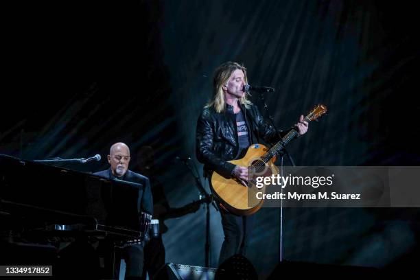 Billy Joel performs with Goo Goo Dolls' frontman John Rzeznik at Highmark Stadium on August 14, 2021 in Buffalo, New York.