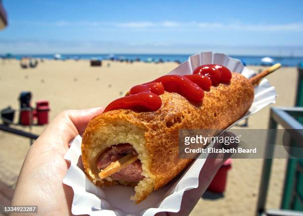 corn dog at santa cruz beach, california - hot dog schnellimbiss stock-fotos und bilder