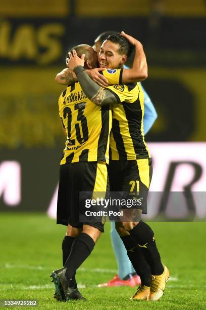 Jesús Trindade of Peñarol celebrates with teammate Walter Gargano after scoring the first goal of his team during a quarter final second leg match...