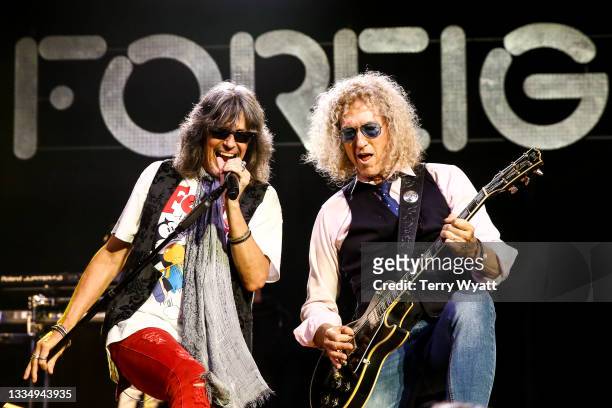 Kelly Hansen and Bruce Watson of Foreigner perform at Ryman Auditorium on August 18, 2021 in Nashville, Tennessee.