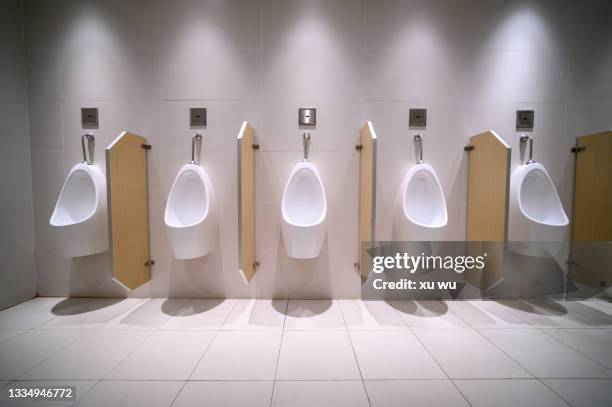 urinating place in public toilets - urinating stock pictures, royalty-free photos & images