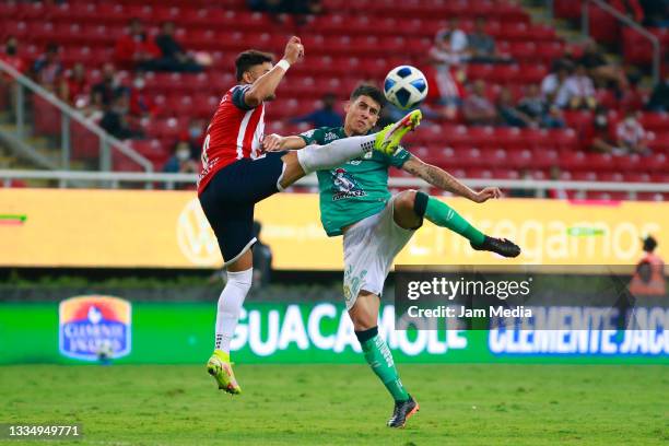 Ernesto Alexis Vega of Chivas fights for the ball with Santiago Colombatto of Leon during the 5th round match between Chivas and Leon as part of the...