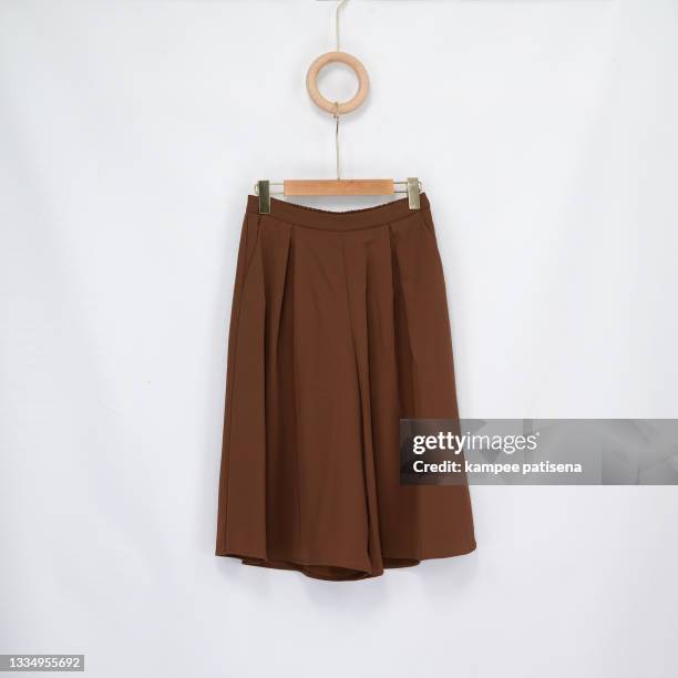 long brown skirt on white background pattern - brun kjol bildbanksfoton och bilder