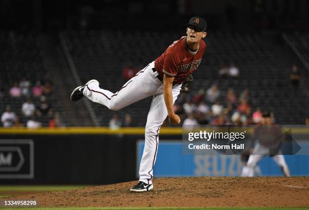 Tyler Clippard of the Arizona Diamondbacks delivers a ninth inning pitch against the Philadelphia Phillies at Chase Field on August 18, 2021 in...