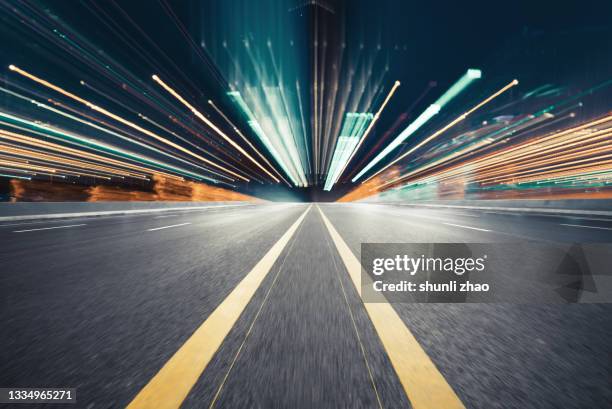 light trail of the city at night - diminishing perspective stock pictures, royalty-free photos & images