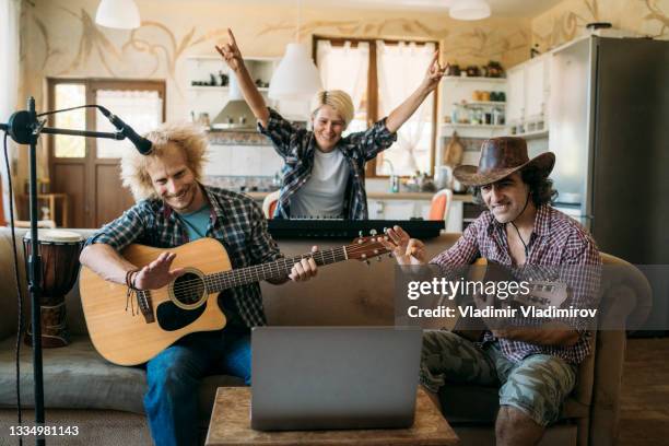 musicians having fun while playing music at home - gig living room stock pictures, royalty-free photos & images