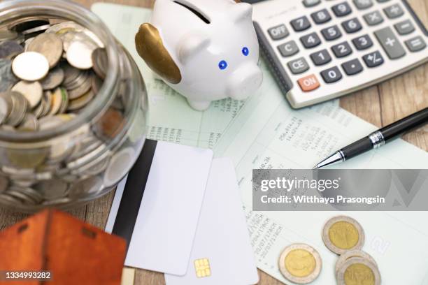 saving account book and statement from bank for business finance loan - payslip stock pictures, royalty-free photos & images