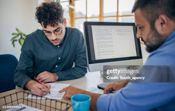 man on job interview - written agreement stock pictures, royalty-free photos & images