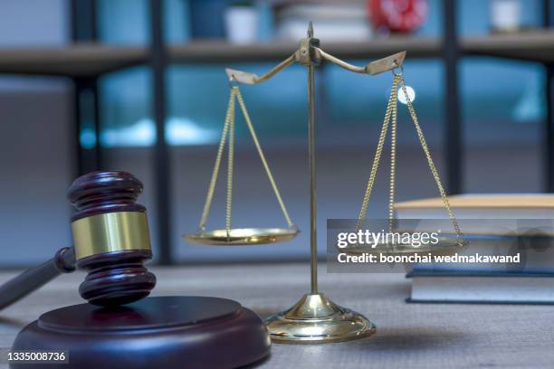 gavel, scales of justice and law books. - legal trial - fotografias e filmes do acervo