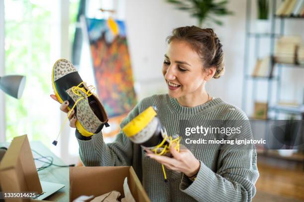 young woman received new boots after online shopping - shoes box stock pictures, royalty-free photos & images